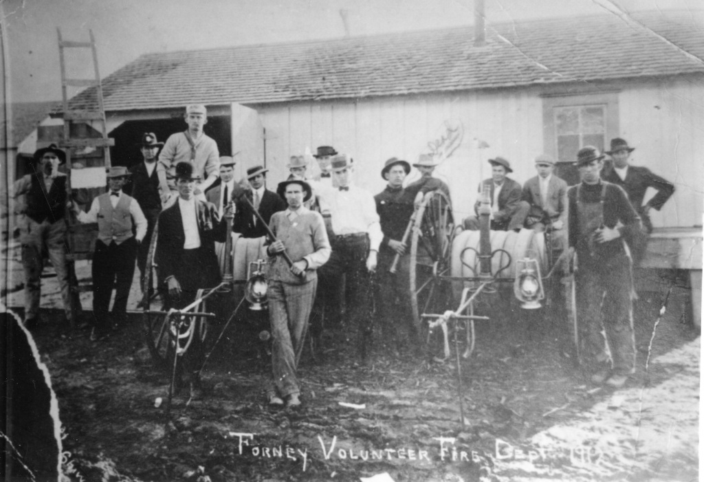 Volunteer Fire Department, 1912. This is on Trinity St. before the brick fire station was built in 1913. 