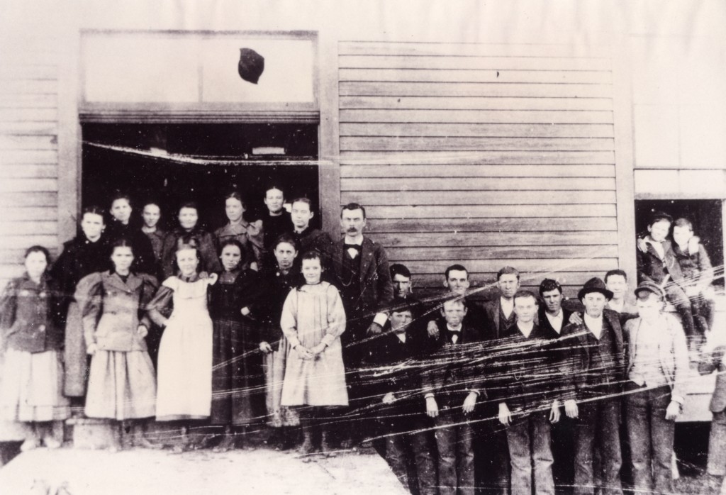 Forney public school after consolidation, 1895-1896. This shows classroom #1 with S.J. Lewis, principal and teacher. 